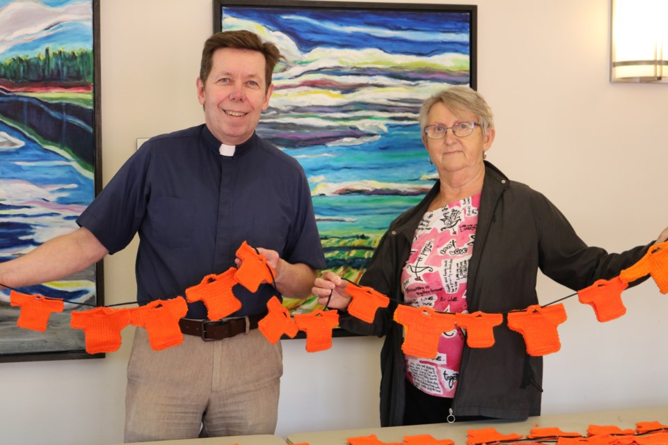 Reverend Paul Walker and Barb Dunsmore, who coordinated the project. 