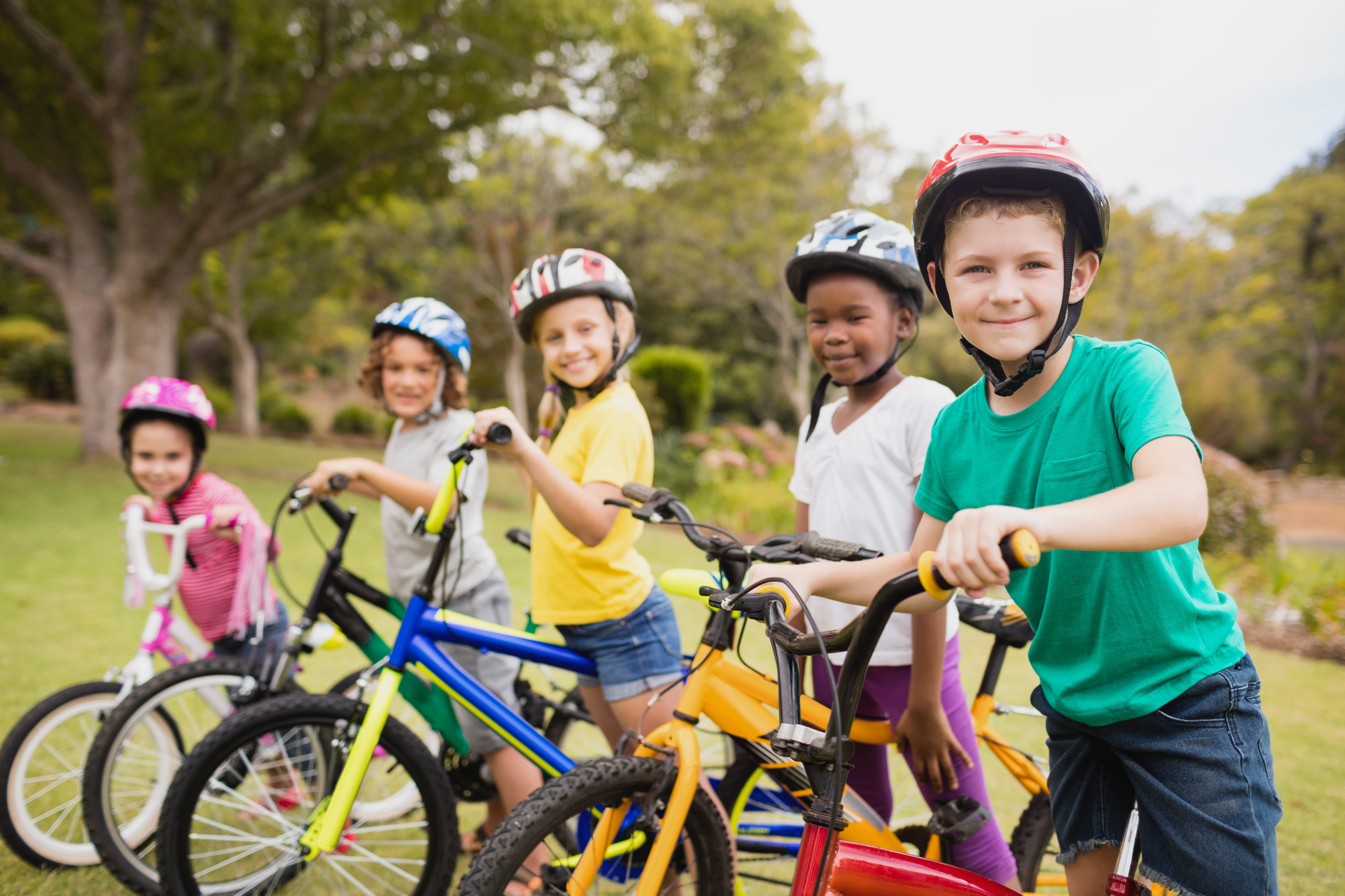 children riding bicycle