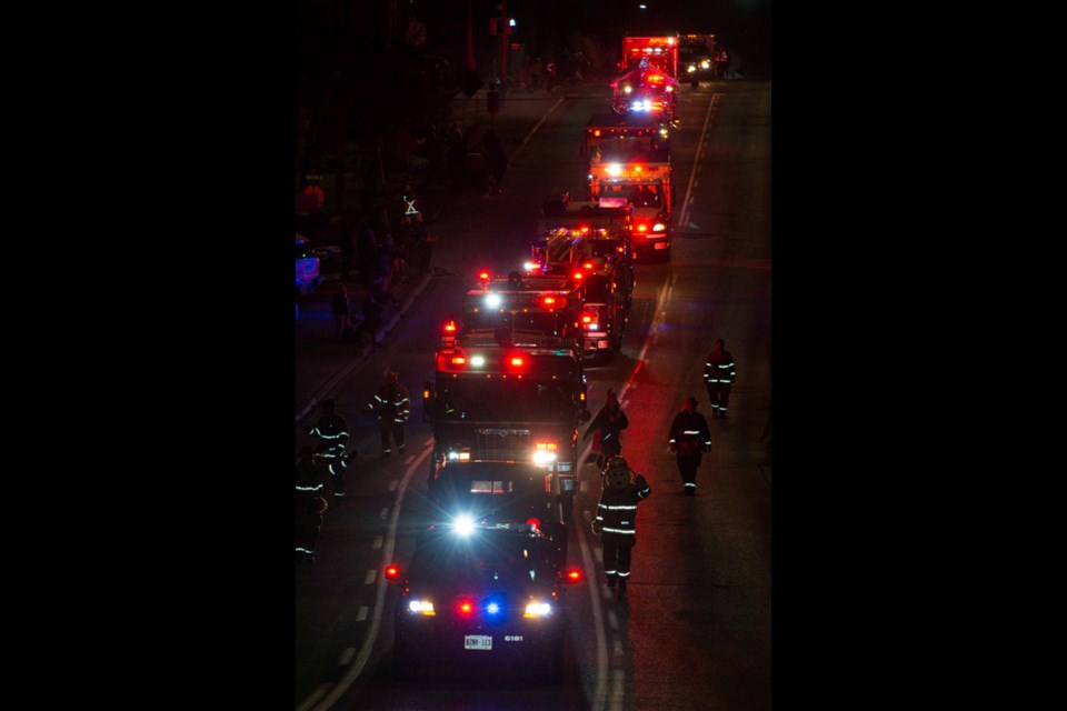 Local emergency services light up the parade.