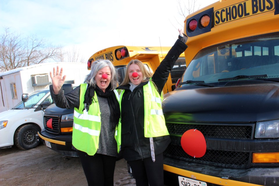 Red Nose Day co-organizer Angela Tyler (left) and Sarah Martin get into the silly spirit of the day.