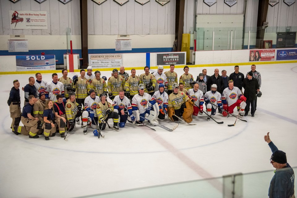 The weekend game at Mold-Masters saw the local firefighters take on hockey heroes to raise money for the Canadian Cancer Society.