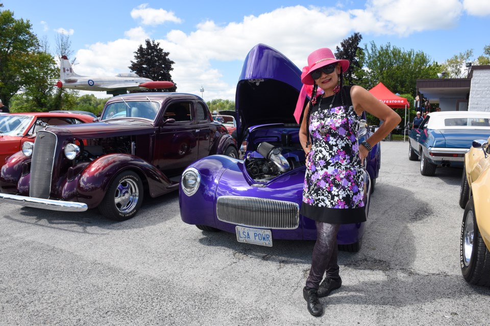 Classic car enthusiast Li Yali  admires a 1941 Willys Coupe.