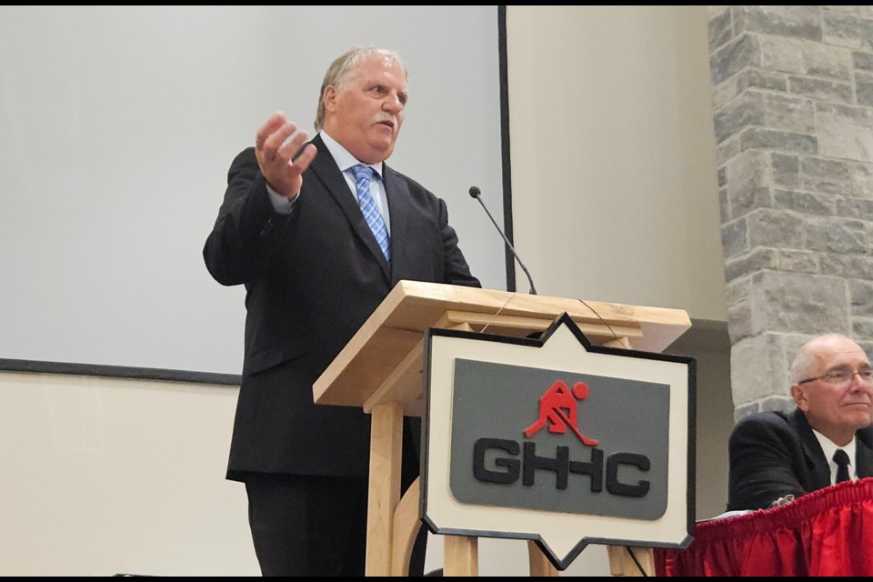 Steve Highfield accepts his Georgetown Hockey Heritage Award Wednesday night at Norval United Church.