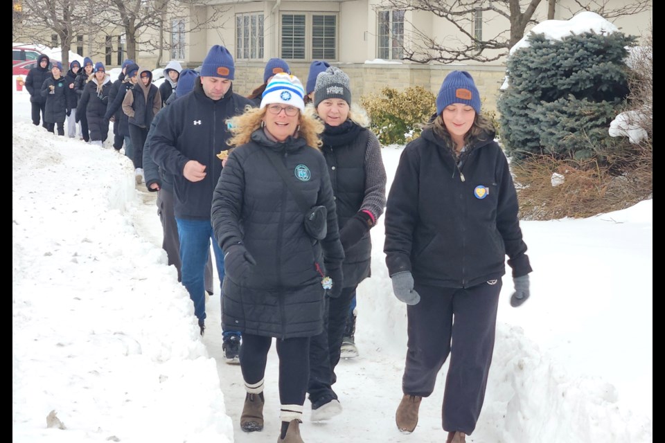 Participants in the Coldest Night of the Year make their way across Argyll Road in Georgetown Saturday. As of early Saturday evening, $59,000 had been raised.