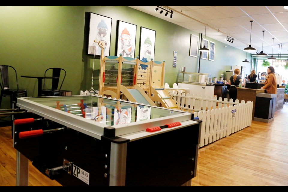 A foosball table and play area for the kids.