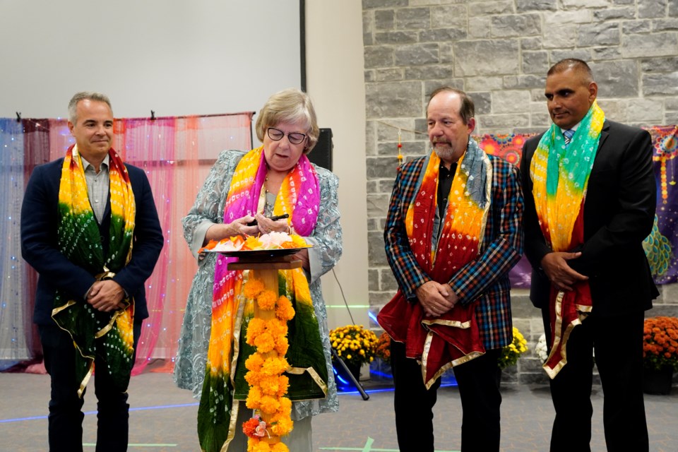 (Left to right) Greg Rusciolelli of the Georgetown Hospital Foundation, Mayor Ann Lawlor, Rick Bonnette representing the Townsend Smith Foundation, and former Milton MPP Parm Gill take turns lighting the diya.               