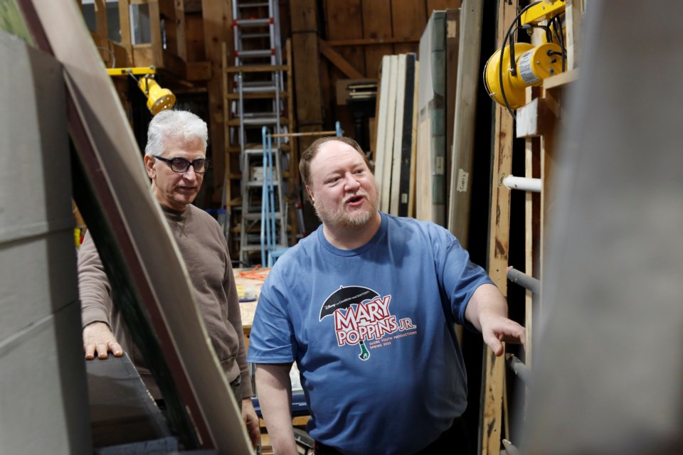 Director Bill Reill (right) and Globe Productions president Mark Llewellyn go through their inventory of set pieces to see what they can use.