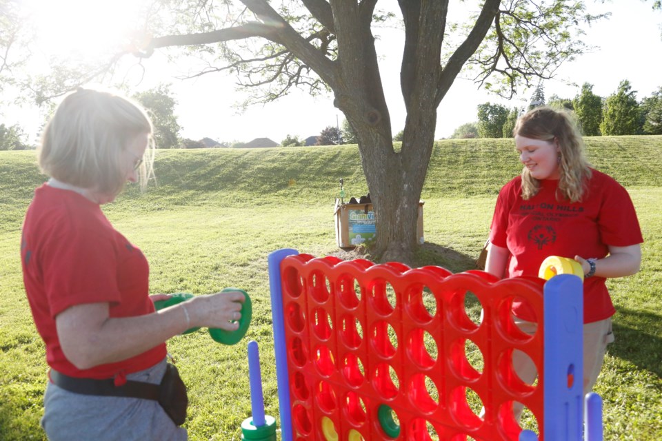 Sarah Padt (right) and Jean Cherwaiko of Halton Hills Special Olympics Ontario play Connect Four.