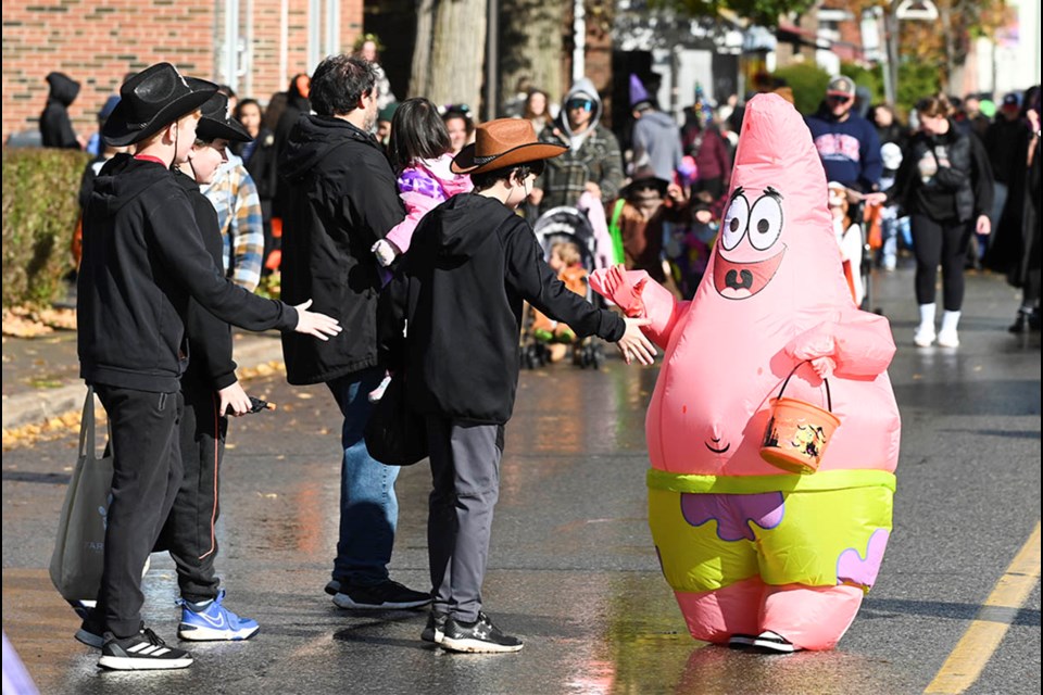 Hundreds dressed in costumes took in the annual Trick or Treat on Mill and Main Streets in downtown Acton.