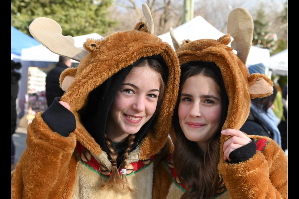  Costumed characters like Lilly, left, and Maggey dressed as reindeer toured the Christmas Market in the Glen, along with Frosty and The Grinch. The market took over the hamlet Sunday afternoon with more than 120 vendors, costumed characters, fire pit warming stations, food trucks and a tree lighting.