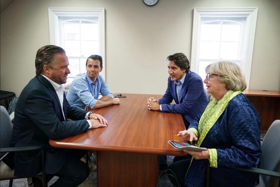 Prime Minister Justin Trudeau meets with Councillor Jason Brass (left), Milton MP Adam van Koeverden and  Halton Hills Mayor Ann Lawlor. 