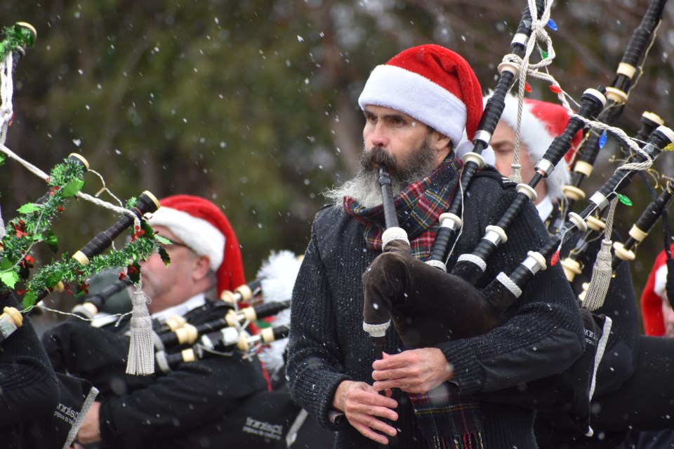 Alan Beauchamp plays the bagpipes during this year's Innisfil Santa Claus parade. 