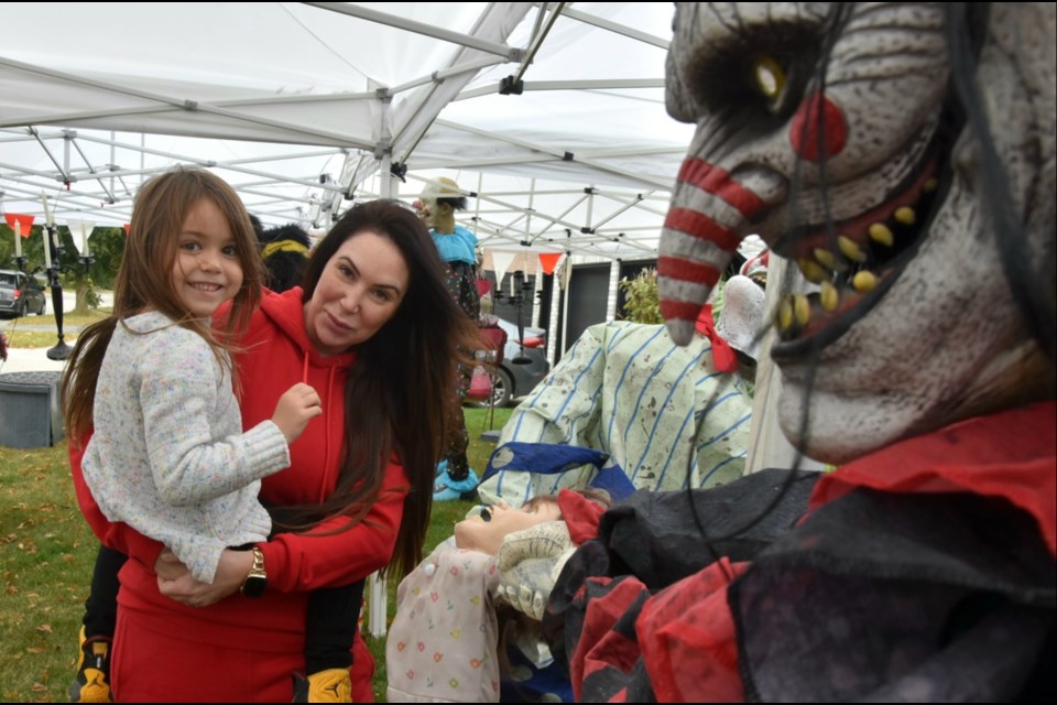 Colleen Walsh and daughter Delilah, 4, are putting up their display for the fourth annual Innisfil House Decorating Contest.