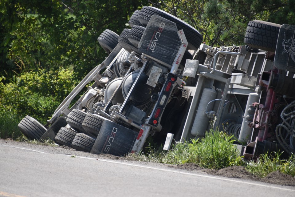 A transport truck rolled into a ditch on the 5th Sideroad in Innisfil July 17. 