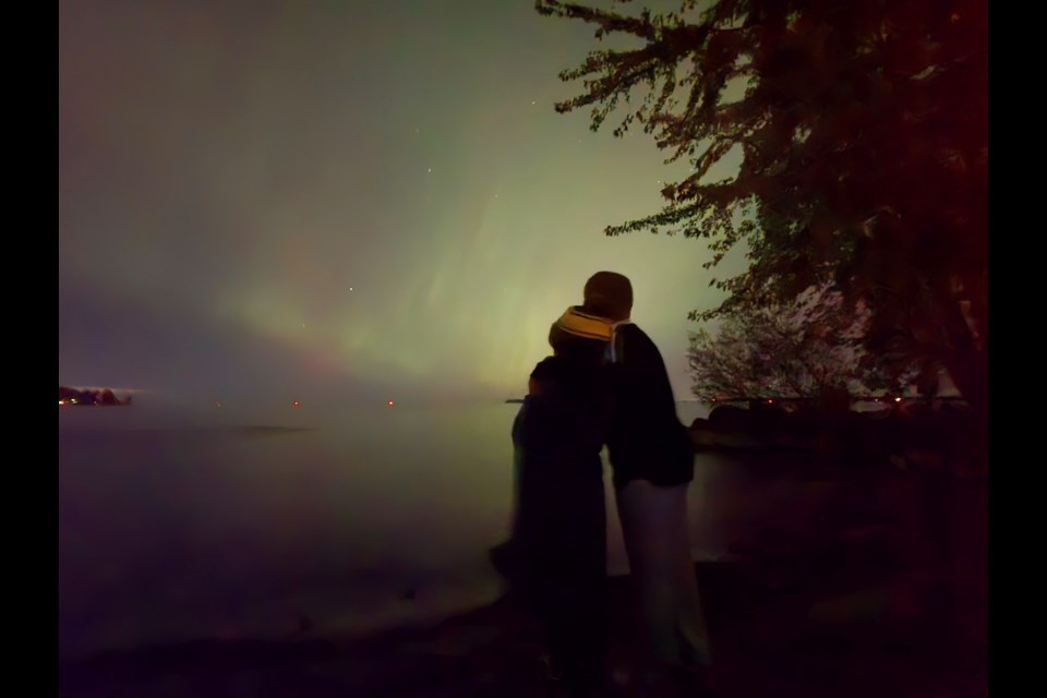 Taking in the northern lights above Lake Simcoe at Innisfil Beach Park Oct. 10. 