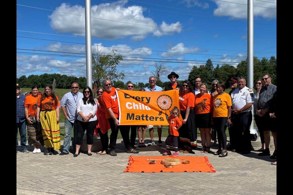 Mayor Lynn Dollin was joined by Ashley and Matthew Bergman and members of council and the community for the Every Child Matters flag raising.