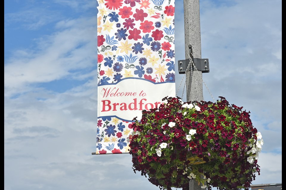 Flowering basket and banner on Bradford's Holland Street. 