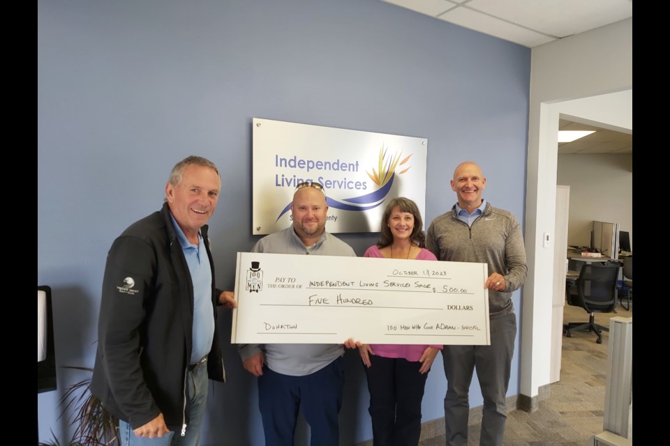 A representative of Independent Living Services is pictured with the co-founders of 100 Men Who Give A Damn Innisfil, left to right: Michael Tough, Brian Sametz, and Wayne Clements.