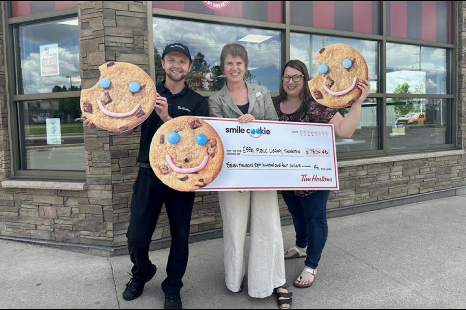 Tim Hortons store manager Darren Boyle, Essa Public Library CEO Laura Wark and Holly Elliott, co-ordinator of family engagement, are shown.