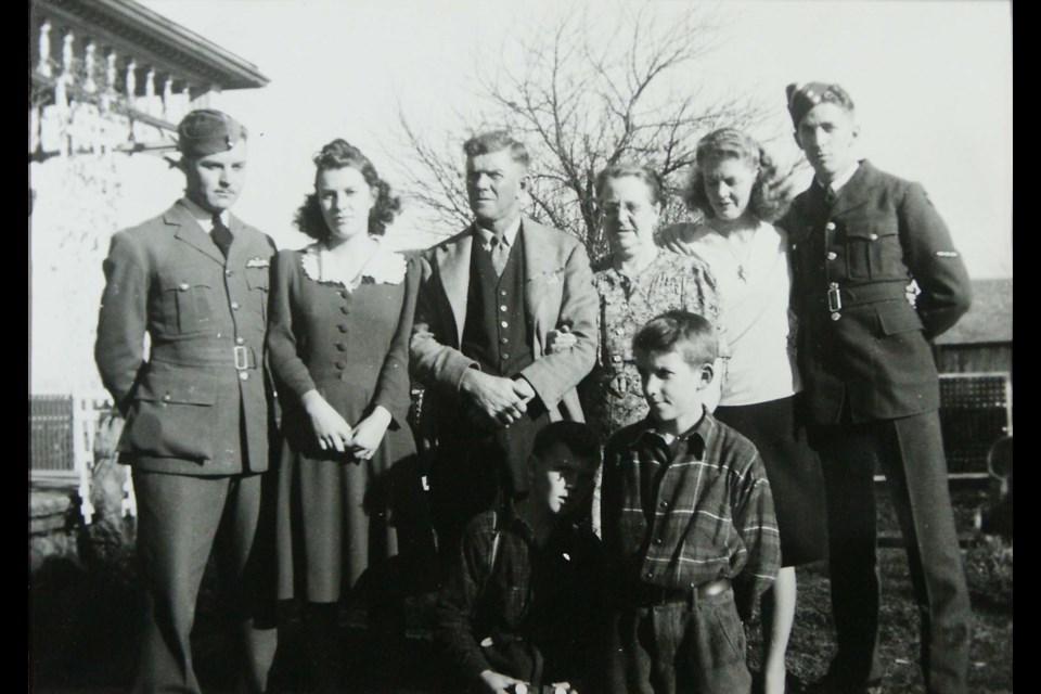 Albert Scott Neilly is shown at right. His elder brother, Louis, stands at the left.