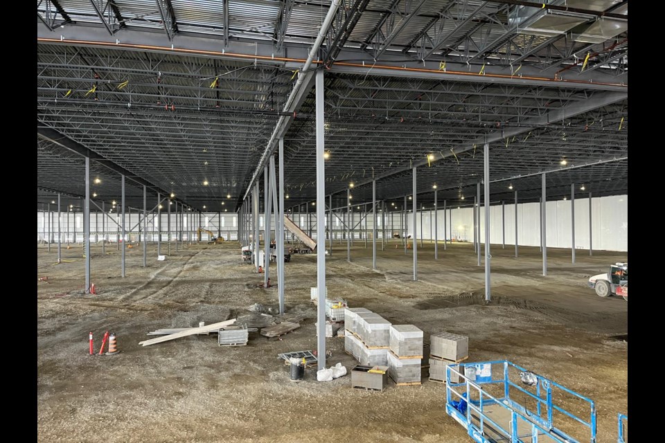 Construction progressing on the concrete floor inside DSV's warehousing facility at the southeast corner of Innisfil Beach Road and the 5th Sideroad.