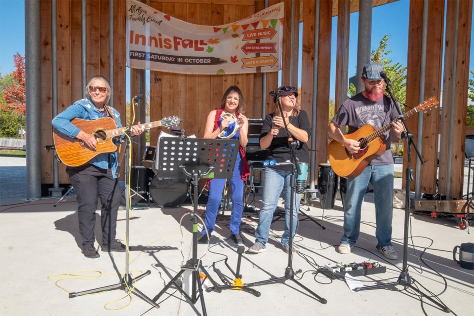 Members of Fitzees along with Patty & Friends get the crowd going at the Town Square on Saturday afternoon.