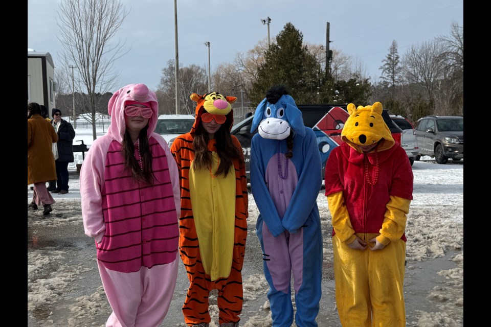 First-time Polar Bear Dip participants dressed like characters: Piglet (Kayleigh Geddes), Tigger (Monique Sacksen), Eeyore (Makenna Arsenault), and Winnie the Pooh (Taia Paradis). They raised about $2,000 for the Innisfil Food Bank.