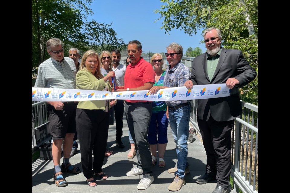 Innisfil Mayor Lynn Dollin and Goodfellow Public School Principal Sean Cappadocia unveil the newly finished Jack Crescent Trail.