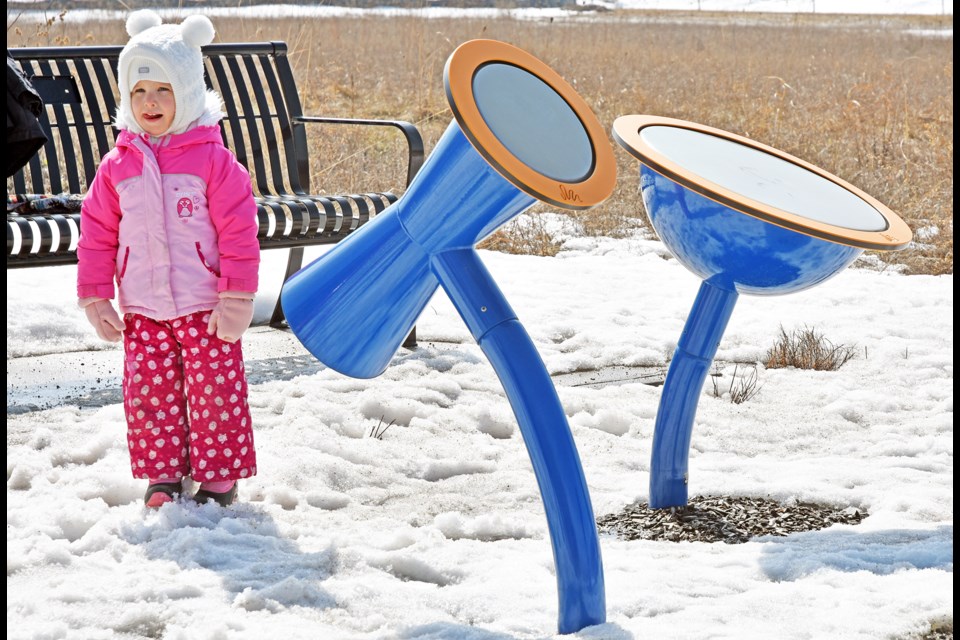 Youngster prepares to participate in the Family Story Stroll - and play a little outdoor music. 