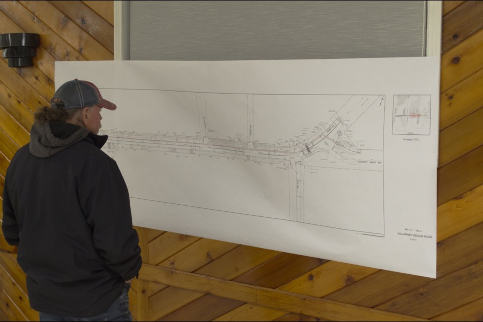 A resident looks at some of the plans for the Killarney Beach Road urbanization project during a public open house in Lefroy, Thursday, Nov. 14.