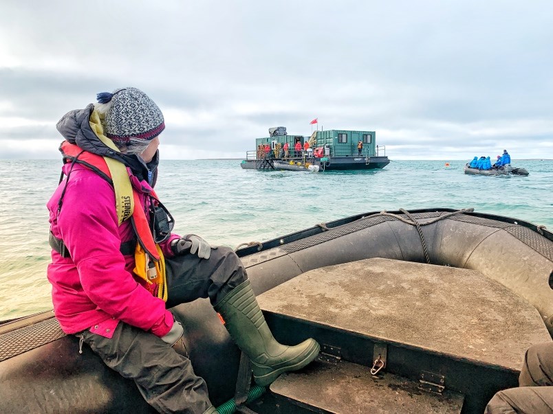 The excitement mounts as the Adventure Canada Zodiacs line up for their turn exploring the diving barge used to explore the Erebus shipwreck. (via Jennifer Bain)