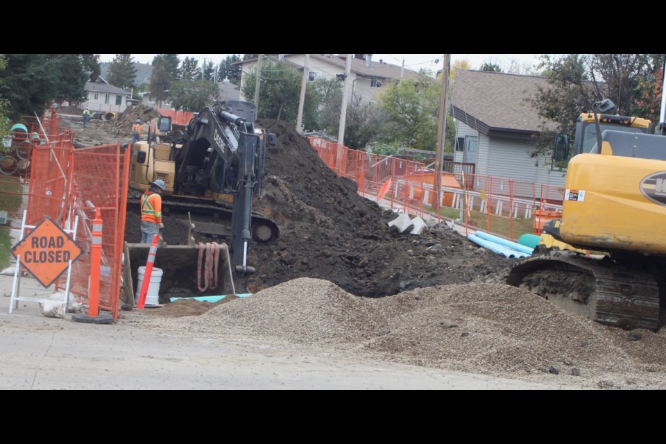 Construction crews work on 104 Ave. between 103 Street and 101 Street near the McGrane Branch #28 of the Royal Canadian Legion  in Lac La Biche. Chris McGarry photo. 