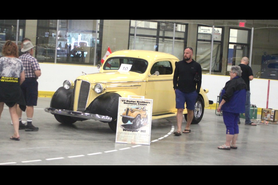 People check out the 1937 Dodge Brothers Business Coupe on display inside the Swamp Cats Arena. Chris McGarry photo. 