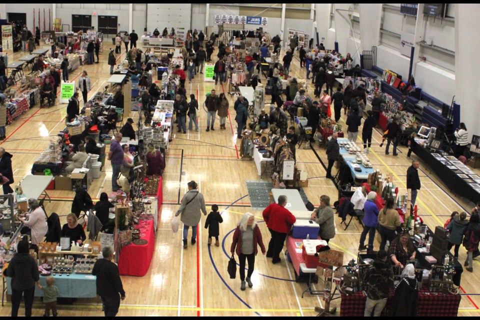 People browsing the rows of vendors inside of the Bold Center during the 2024 Christmas Shopping Extravaganza. Chris McGarry photo. 