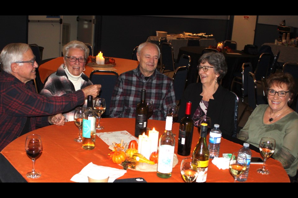 Andre Contant, Giwette Beauchemi, Jacques Labonte, Lena Labonte and Susette Menard-Dube enjoy some refreshments and friendship during the cocktail hour that kicked off the 42nd annual Plamondon Harvest Festival, which took place on Saturday, Nov. 16 at the Philip-Ménard Cultural Center in the hamlet of Plamondon in Lac La Biche County. Chris McGarry photo. 