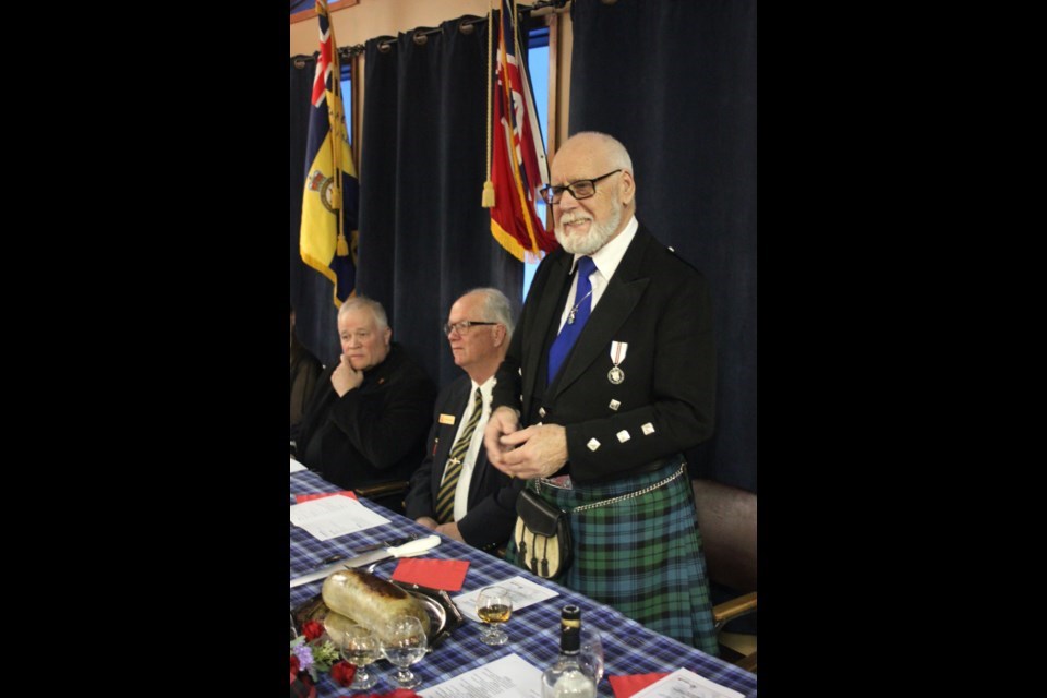 Angus Campbell delivers the ‘Address to a Haggis’ before cutting it during the Robbie Burns Night event held last year at the Lac La Biche Branch of the Royal Canadian Legion. Chris McGarry photo.