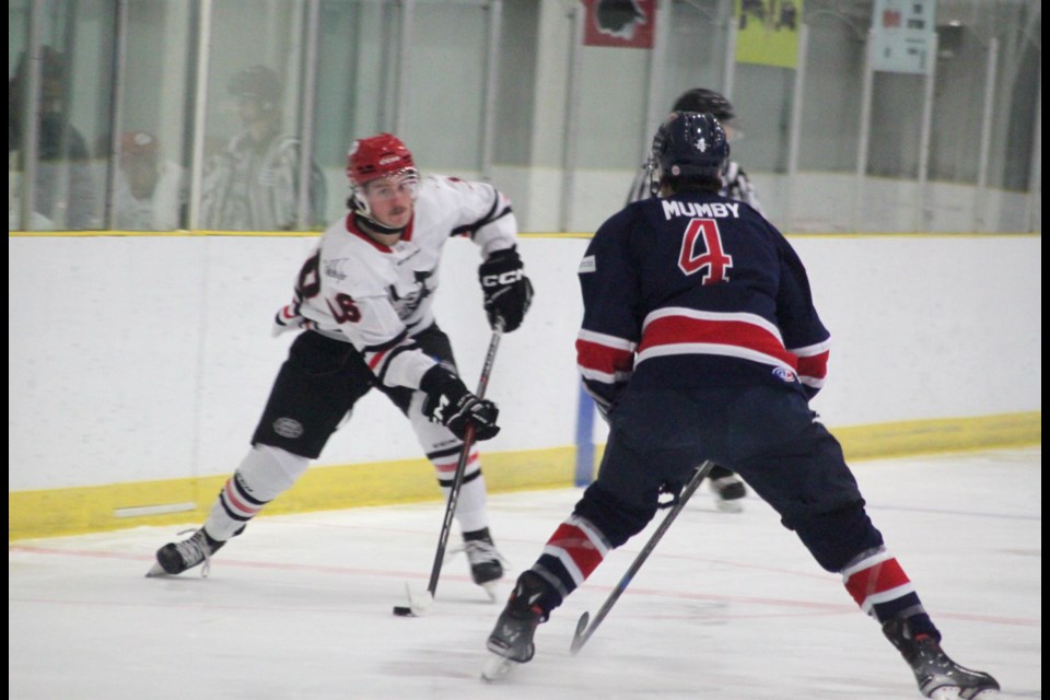 Portage College Voyageurs defenseman Austin Mumby obstructs a member of the Augustana Vikings as he advances towards the Voyageurs zone during Saturday’s game at the Bold Center that saw the Vikings finish with a 10-2 victory. Chris McGarry photo. 