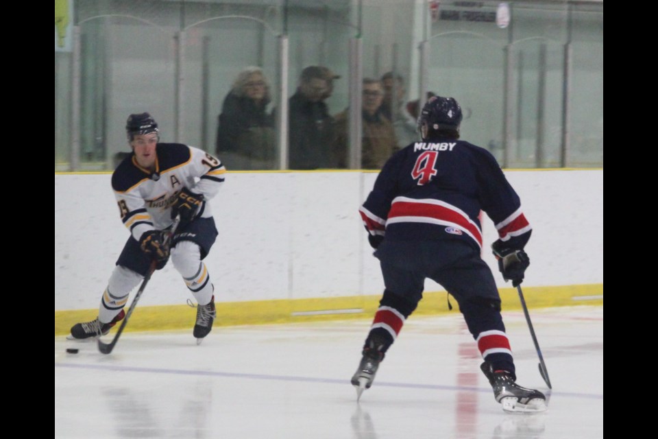 Portage College Voyageurs defenseman Austin Mumby gets ready to intercept Zackery Carlson of the Concordia University Thunder as he intrudes into the Voyageurs zone during the Friday, Jan. 10 game at the Bold Center. The match resulted in a 4-3 victory for Concordia. Chris McGarry photo. 