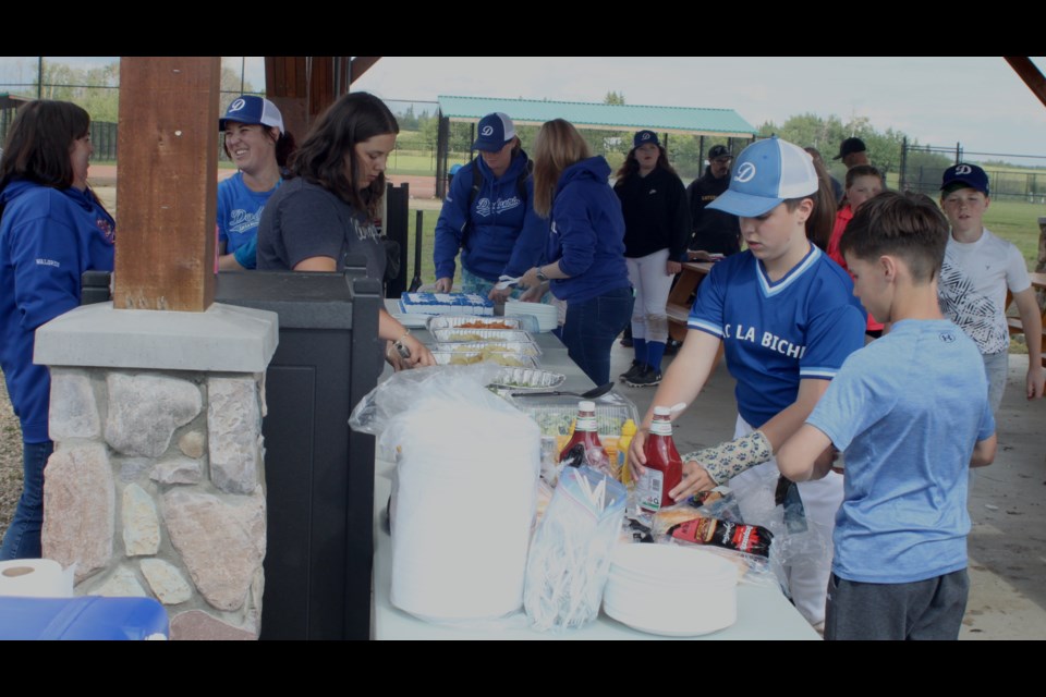 The gazebo next to the Bold Centre ball diamonds was a busy place Tuesday evening as local ball players, parents, and officials got together for a barbeque to wrap up the minor ball season. Chris McGarry photo.