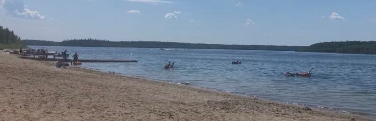 People swimming and boating in Beaver Lake. Chris McGarry photo. 