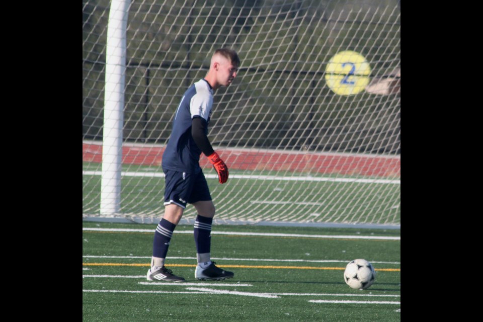 Ben Kenny preparing to kick the ball out into the field. Chris McGarry photo. 