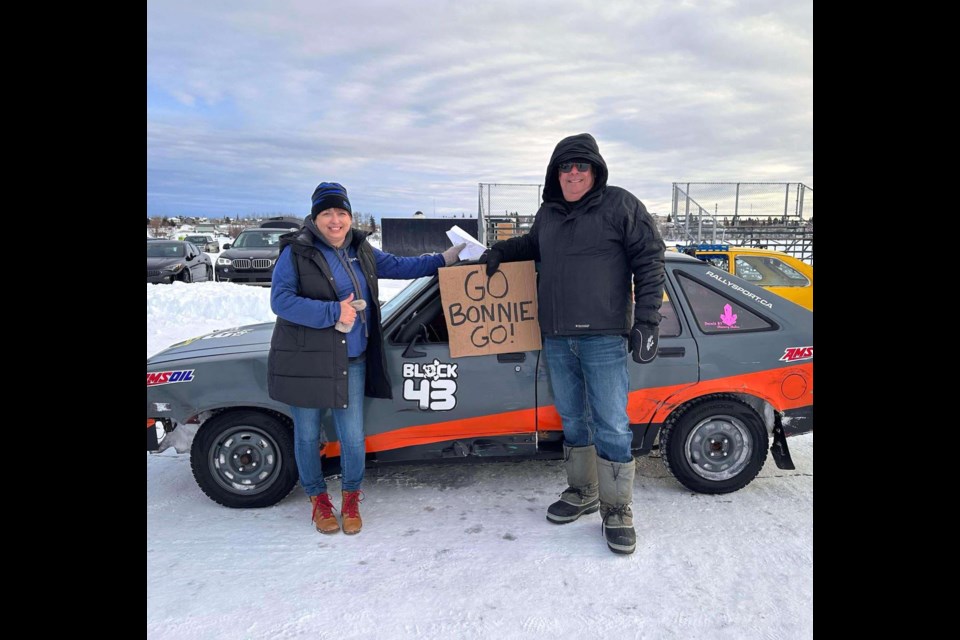 Bonnie Cadieux-Piquette standing beside the Chevette she drove in the charity race for the 2023 Winter Festival of Speed. Photo supplied. 