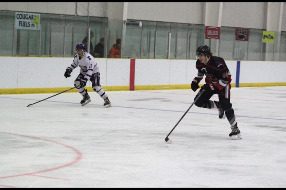 Lac La Biche Lakers forward Brayden Swedgen stays on Edson Eagles player Zane Campbell as he moves into the Lakers’ zone. Chris McGarry photo. 