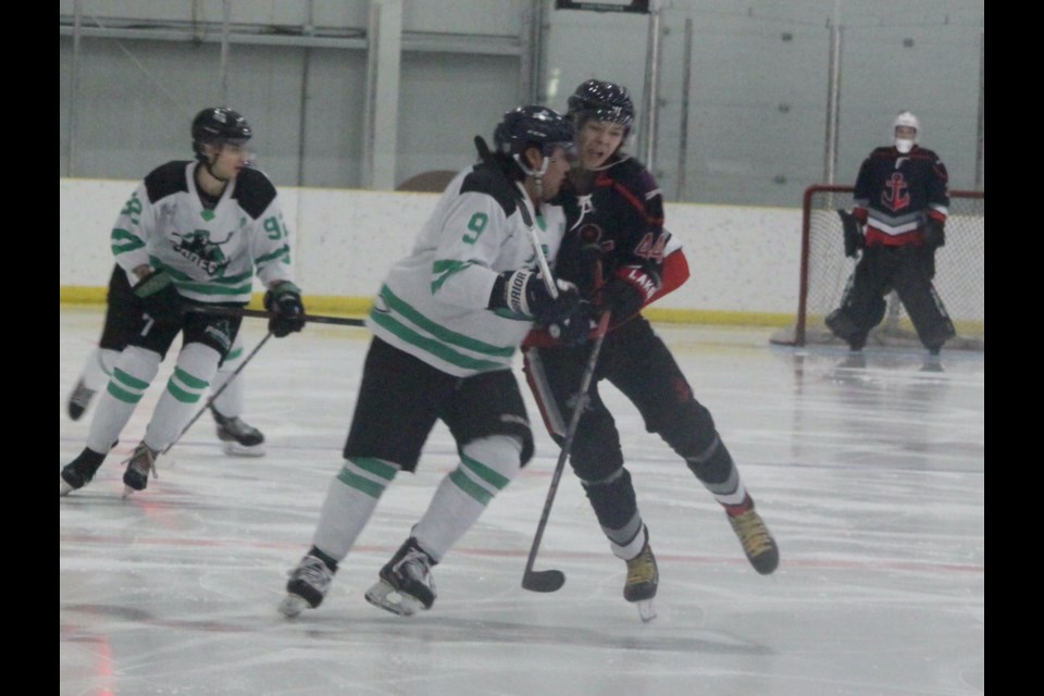 Lac La Biche Lakers forward Brayden Swedgen collides with a member of the Gibbons Pioneers during Friday’s meeting between the two teams at the Bold Center. Chris McGarry photo. 