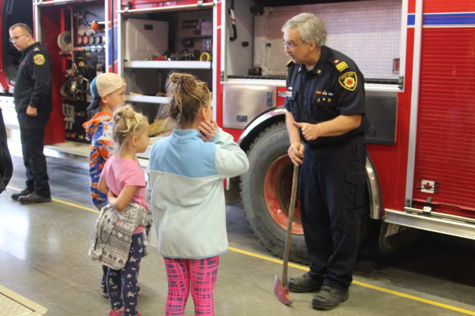 Little visitors had the opportunity to learn about the firefighter equipment and speak to firefighters at the Downtown Cold Lake Fire Rescue station . 