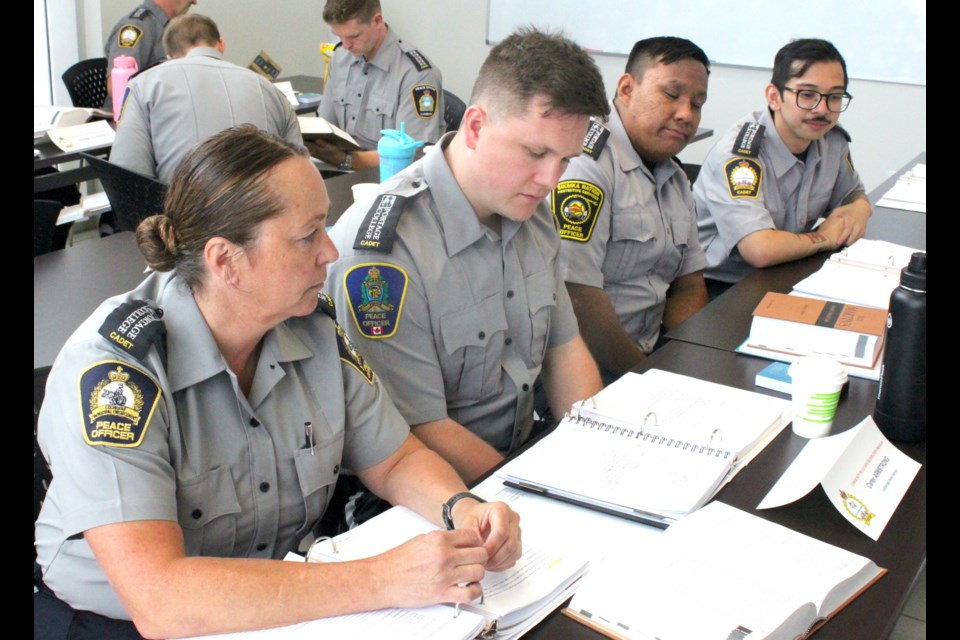 Community peace officer cadets Sam Casselton, Carter Armstrong, Ramsay Jerry, and Dehn Rallos hit the books during a legal studies class on Wednesday at the Law Enforcement Training Center in Lac La Biche. Chris McGarry photo.