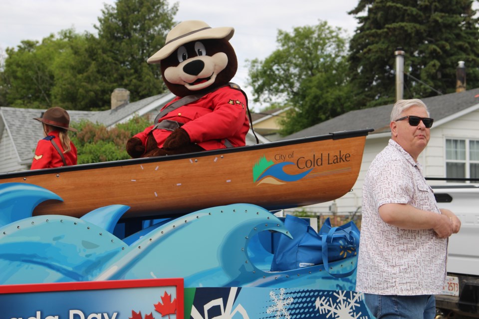 The City of Cold Lake float and its mascot, along with Coun. Bob Mattice throwing out candy to watchers.