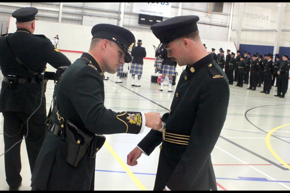 Carter Martindale and Chaz Perry do the final preparations on their uniforms prior to the start of the graduation ceremony for Troop #26 of the Western Conservation Law Enforcement Academy (WCLEA) in Lac La Biche. The event took place on Thursday, Sept. 5 at the Bold Centre. 