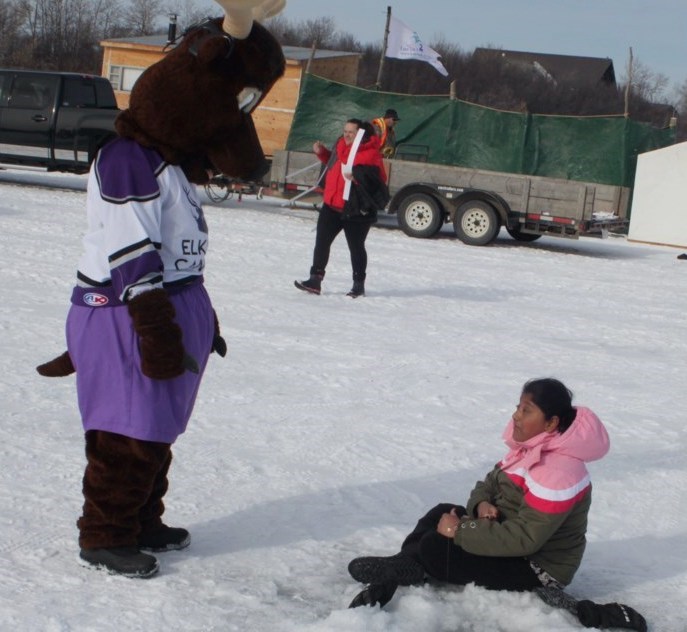 The Elks' mascot, 'Charlie the Elk' chats with a youngster who attended the 2024 event, which took place at Sir Winston Churchill Provincial Park. Chris McGarry photo. 