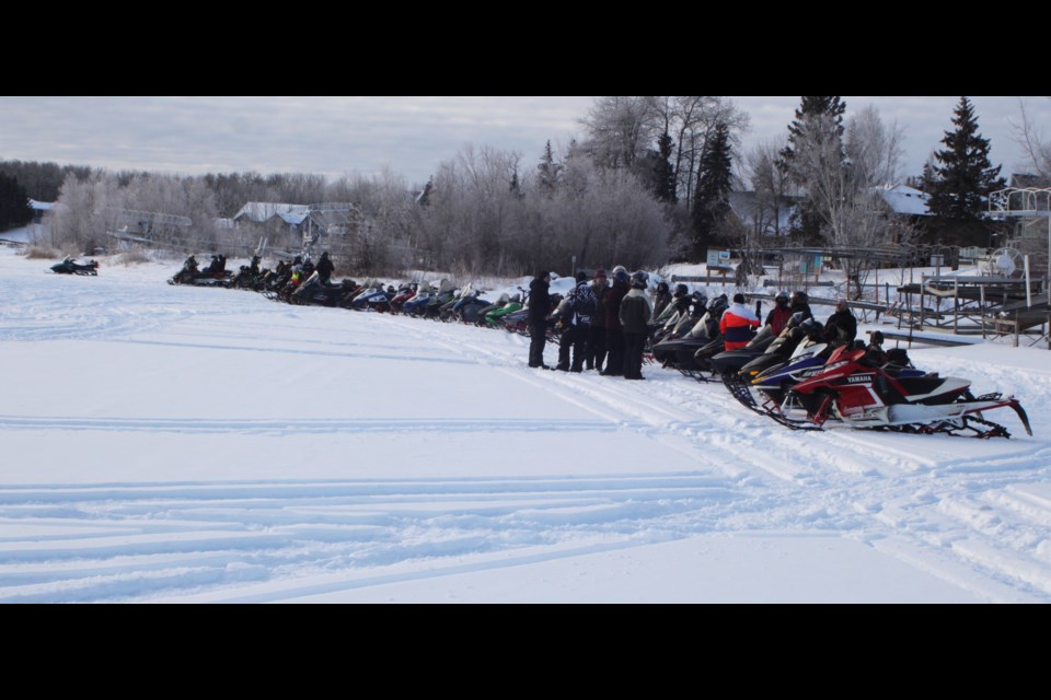 Snowmobilers lined up on the shore of Beaver Lake prior to the start of the Lac La Biche Back Country Riders 3rd annual chili fundraiser, which took place on Saturday, Jan. 25. Chris McGarry photo. 